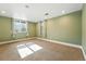 Spacious carpeted bedroom with windows and neutral wall color at 1731 Locust St, Denver, CO 80220