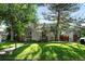 Charming home featuring a well-manicured lawn, mature trees, and inviting curb appeal in a serene neighborhood at 1731 Locust St, Denver, CO 80220