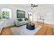 Cozy living room with hardwood floors, decorative fireplace, and natural light at 1731 Locust St, Denver, CO 80220