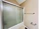 Bathroom offering a shower with sliding glass doors, and neutral paint at 4111 E 94Th Ave # E, Thornton, CO 80229