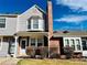 Charming townhouse with a well-maintained front yard, brick chimney, and lovely bay window that adds architectural detail at 4111 E 94Th Ave # E, Thornton, CO 80229
