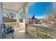Spacious front porch perfect for relaxation, showcasing an American flag and neighborhood view at 9478 E 108Th Ave, Commerce City, CO 80640