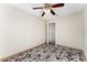 Bedroom features ceiling fan, neutral walls, and door to another room at 9478 E 108Th Ave, Commerce City, CO 80640