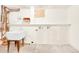 Unfinished basement featuring a utility sink, plumbing, and electrical connections at 2901 Monaco Pkwy, Denver, CO 80207