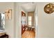 Inviting home entryway with hardwood floors, bench seating, and decorative accents at 2901 Monaco Pkwy, Denver, CO 80207