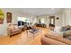 Comfortable living room with hardwood floors, large windows, and stylish decor at 2901 Monaco Pkwy, Denver, CO 80207