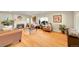 Bright and airy living room featuring hardwood floors, a cozy fireplace, and ample seating at 2901 Monaco Pkwy, Denver, CO 80207
