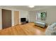 Well-lit living room with hardwood floors, modern decor, and large windows offering a scenic view at 2901 Monaco Pkwy, Denver, CO 80207