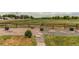 The backyard features a rock area bordered by a wooden fence and views of an expansive field at 11183 E 114Th Ave, Commerce City, CO 80640