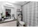Bathroom with a shower, toilet, and vanity with neutral tones and decorative elements at 11183 E 114Th Ave, Commerce City, CO 80640
