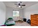 Simple bedroom with a window, carpet, and play area at 11183 E 114Th Ave, Commerce City, CO 80640