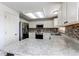 Well-lit kitchen featuring stainless steel appliances, white cabinetry, and a decorative backsplash at 11183 E 114Th Ave, Commerce City, CO 80640