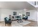 Inviting living room with cozy seating, modern art, and ample natural light, creating a comfortable space at 11183 E 114Th Ave, Commerce City, CO 80640
