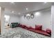 Spacious living room area with a decorative rug, recessed lighting, and seating at 11183 E 114Th Ave, Commerce City, CO 80640
