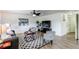 Well-lit living room with comfortable seating, a modern entertainment center, and a welcoming atmosphere at 11183 E 114Th Ave, Commerce City, CO 80640