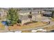 Aerial view of a residential area with well-kept lawns and multiple car garages at 22029 E Irish Dr, Aurora, CO 80016