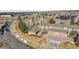 Aerial view of the community showing the landscaping, multiple homes, and garage parking at 22029 E Irish Dr, Aurora, CO 80016