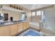 Bathroom featuring double sinks, a tub, and a glass-enclosed shower at 22029 E Irish Dr, Aurora, CO 80016