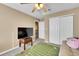 Bedroom featuring a football themed rug, closet, and neutral colored walls at 22029 E Irish Dr, Aurora, CO 80016