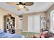 Bedroom featuring a sliding door closet, football themed rug, and neutral colored walls at 22029 E Irish Dr, Aurora, CO 80016