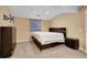 Bedroom with neutral carpet, a dark wood bed frame, and matching dressers at 22029 E Irish Dr, Aurora, CO 80016