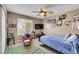 Bedroom with football themed decor, chair, bed, and natural lighting at 22029 E Irish Dr, Aurora, CO 80016