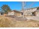 Townhome exterior featuring stone accents, a two-car garage, and neutral siding at 22029 E Irish Dr, Aurora, CO 80016