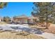 Exterior view of home with siding and stone accents, plus a sidewalk and sparse landscaping at 22029 E Irish Dr, Aurora, CO 80016