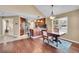 Kitchen and dining area with hardwood floors and stainless steel appliances at 22029 E Irish Dr, Aurora, CO 80016