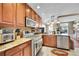 Well-appointed kitchen with modern stainless steel appliances and granite countertops at 22029 E Irish Dr, Aurora, CO 80016