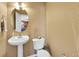 Compact powder room with pedestal sink and modern fixtures at 22029 E Irish Dr, Aurora, CO 80016