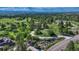 Aerial view showcasing homes in the lush, rolling landscape at 5519 Ponderosa Dr, Parker, CO 80134