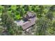 Aerial image showcasing the home's layout, driveway and treed surroundings at 5519 Ponderosa Dr, Parker, CO 80134