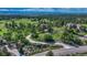 Panoramic aerial view of neighborhood with rolling hills and trees at 5519 Ponderosa Dr, Parker, CO 80134