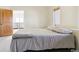 Minimalist bedroom with a bed, a window and neutral color tones at 5519 Ponderosa Dr, Parker, CO 80134