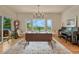Bright dining room featuring a piano, ample seating, decorative rug, and lovely view at 5519 Ponderosa Dr, Parker, CO 80134