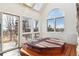 Relaxing sunroom with hot tub, skylights, and scenic outdoor views from many windows at 5519 Ponderosa Dr, Parker, CO 80134