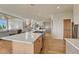 Bright open concept kitchen featuring an island, spiral staircase, and modern appliances at 5519 Ponderosa Dr, Parker, CO 80134
