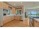 Well-lit kitchen featuring a large window, stainless steel appliances, and wood cabinets at 5519 Ponderosa Dr, Parker, CO 80134