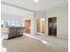 Spacious living room featuring plush carpet, recessed lighting, and multiple entryways at 5519 Ponderosa Dr, Parker, CO 80134