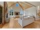 Spacious living room with vaulted ceilings, fireplace, hardwood floors, and natural light at 5519 Ponderosa Dr, Parker, CO 80134