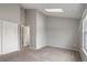 Bright bedroom featuring vaulted ceiling, skylight, neutral walls, and carpeted floor with closet at 9624 W Chatfield Ave # D, Littleton, CO 80128