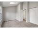 Bedroom featuring vaulted ceiling, skylight, neutral walls, and carpeted floor with walk-in closet at 9624 W Chatfield Ave # D, Littleton, CO 80128