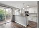 Stylish kitchen with granite countertops, stainless steel appliances, and backyard access at 9624 W Chatfield Ave # D, Littleton, CO 80128