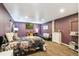 Spacious bedroom featuring a floral bedspread and a TV mounted on the wall at 8240 Clayton Ct, Denver, CO 80229