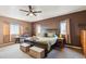 Spacious main bedroom with a large bed, natural light, and cozy furniture at 8240 Clayton Ct, Denver, CO 80229