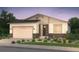 Charming single-Gathering home with a two-car garage and stone accents, surrounded by lush landscaping at 2194 S Ider Way, Aurora, CO 80018