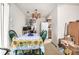 View of dining area with table and chairs and view into kitchen at 2201 Sable Blvd # 1003, Aurora, CO 80011