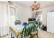 Bright dining area featuring a table with green chairs and natural light at 2201 Sable Blvd # 1003, Aurora, CO 80011