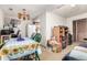 View of dining area with table and chairs and view into kitchen at 2201 Sable Blvd # 1003, Aurora, CO 80011